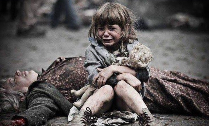 False: This image shows a little girl crying next to her deceased mother due to the war after the Russian invasion of Ukraine.